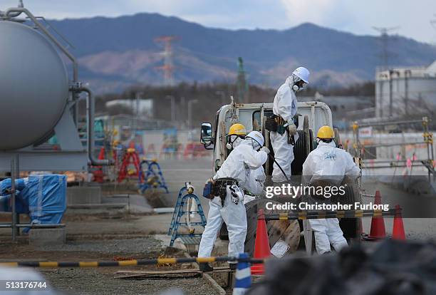 Workers continue the decontamination and reconstruction process at the Tokyo Electric Power Co.'s embattled Fukushima Daiichi nuclear power plant on...