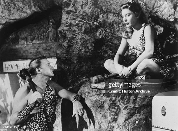 American actors Sonny Tufts and Barbara Payton appear dressed as cave people in a publicity still from 'Run for the Hills,' a musical featuring songs...