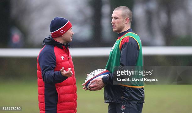 Eddie Jones, the England head coach , talks to fullback Mike Brown during the England training session held at the University of Bath on March 1,...