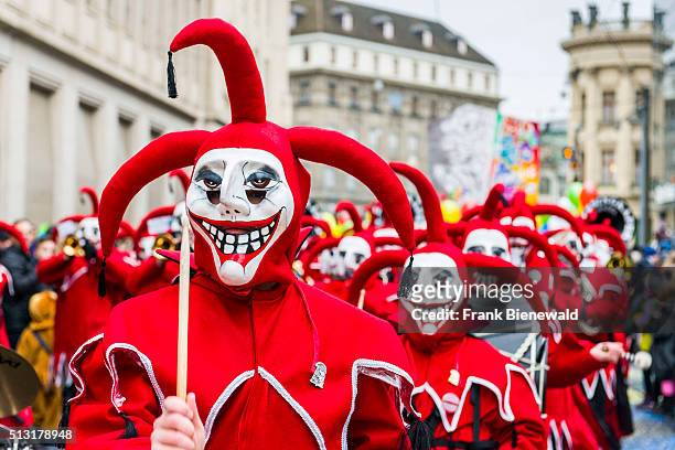 Masked men and women are joining the great procession of Basler Fasnacht, one of the most spectacular events . Many different groups of masked people...