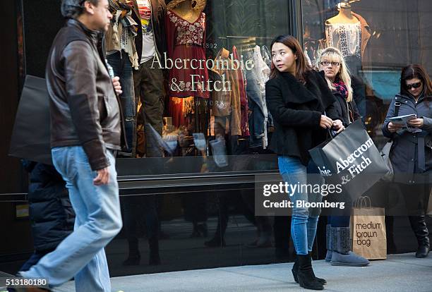 Pedestrians stand outside of the Abercrombie & Fitch Co. Store on 5th Avenue in New York, U.S., on Sunday, Feb. 28, 2016. Abercrombie & Fitch Co. Is...