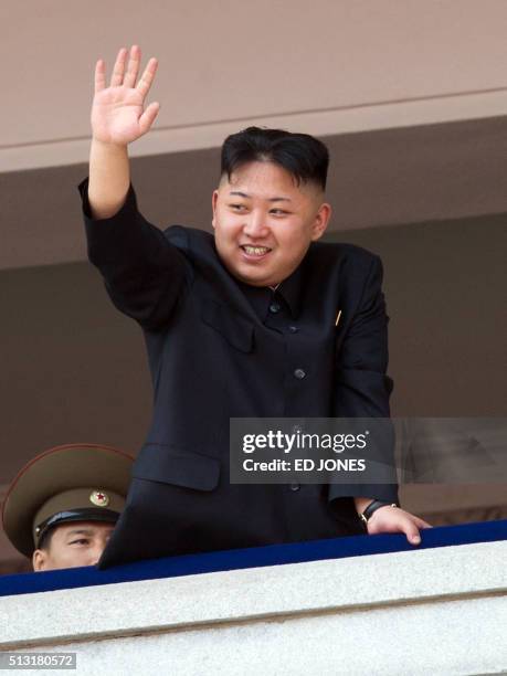 North Korean leader Kim Jong-Un waves after watching a military parade in honour of the 100th birthday of the late North Korean leader Kim Il-Sung in...