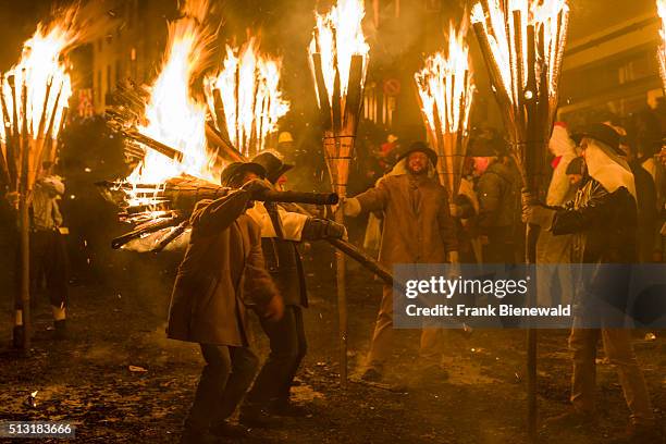 The Chienbäse is part of the Basler Fasnacht, carriers loaded with burning wood are pulled and carried through town, watched by the spectators and...