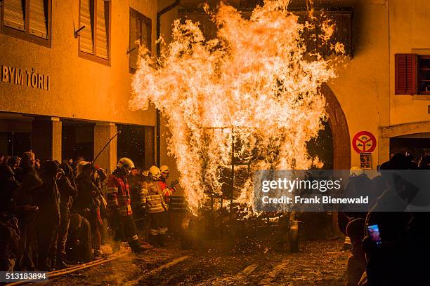 The Chienbäse is part of the Basler Fasnacht, carriers loaded with burning wood are pulled and carried through town, watched by the spectators and...