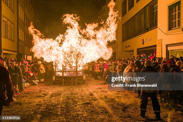 The Chienbäse is part of the Basler Fasnacht, carriers loaded with burning wood are pulled and carried through town, watched by the spectators and...