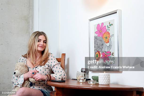 Writer Jen Kirsch poses in her Toronto apartment with her teddybear 'Hope', February 25, 2016. For a first-person story on how the Jian Ghomeshi case...