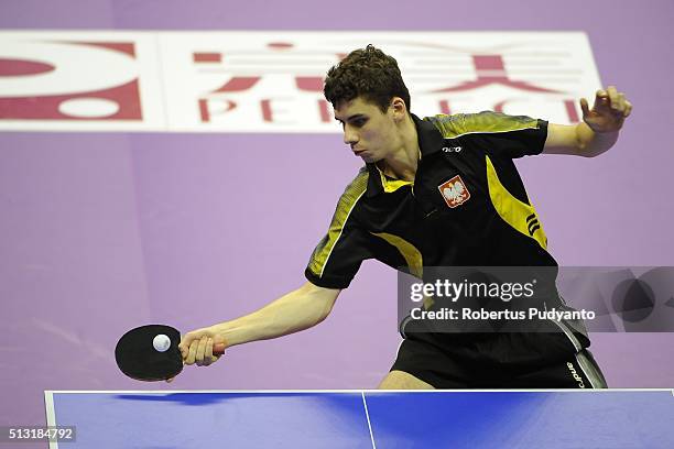 Jakub Dyjas of Poland competes against Tiago Apolonia of Portugal during the 2016 World Table Tennis Championship Men's Team Division Round 4 match...