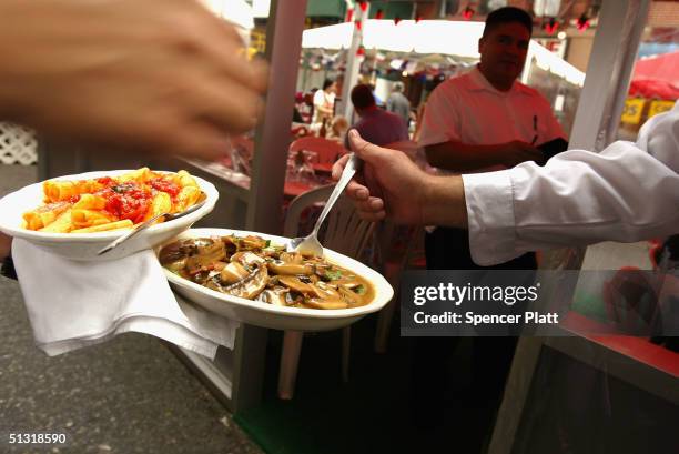 Italian food is prepared at the annual Feast of San Gennaro festival September 17, 2004 in New York City. The annual Italian festival has taken place...