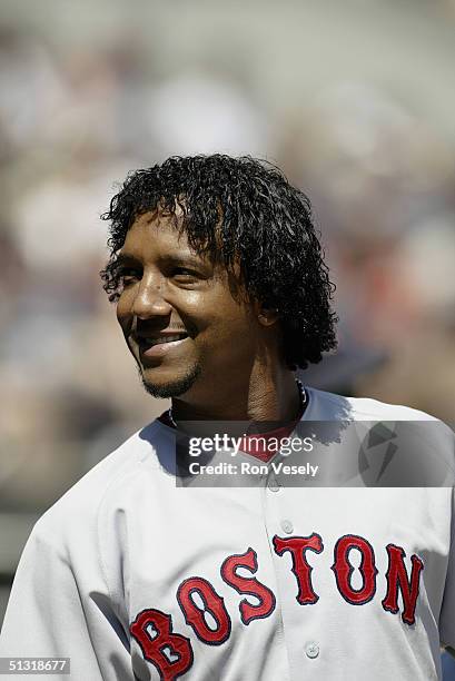 Pitcher Pedro Martinez of the Boston Red Sox smiles during the game against the Chicago White Sox at U.S. Cellular Field on August 21, 2004 in...