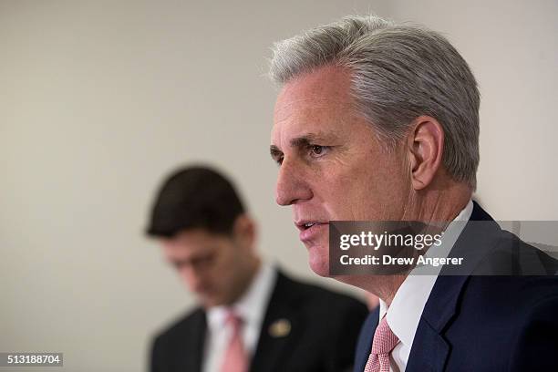 Speaker of the House Paul Ryan listens as House Majority Leader Rep. Kevin McCarthy speaks to the media after closed-door meeting with House...