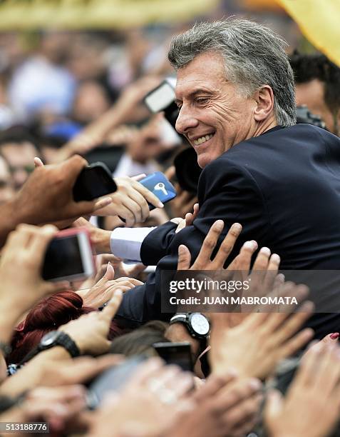 Argentine President Mauricio Macri is greeted by supporters after the inauguration of the 134th period of ordinary sessions at the Congress in Buenos...