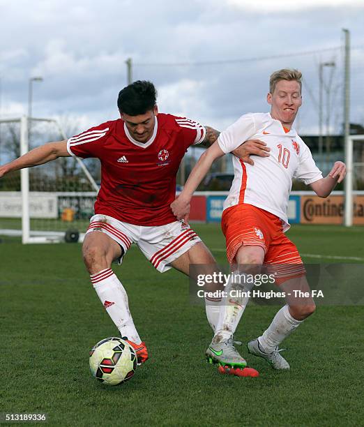 Jack Rutter of Great Britain and Daan Dikken of Netherlands battle for the ball during the CP Tri Nations Tournament match between Great Britain and...