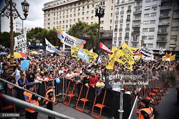 People greet president of Argentina Mauricio Macri as he leaves in a car after the inauguration of the 134th Period of Congress Ordinary Sessions on...