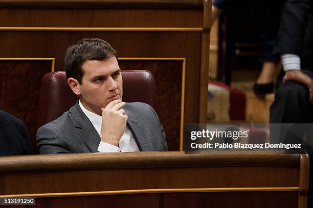 Ciudadanos party leader Albert Rivera listens the speech of Spanish Socialist Party leader Pedro Sanchez, during a debate to form a new government at...