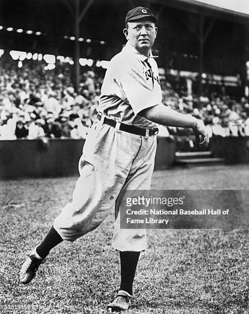 Cy Young pitches for a Cleveland team as he poses for an action portrait. In a career that spanned 21 seasons, Denton True "Cy" Young played for the...