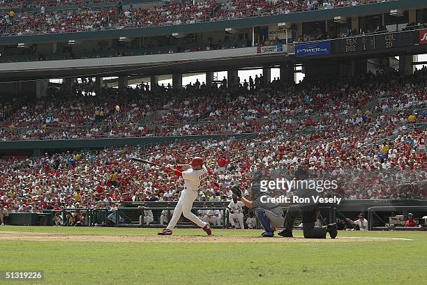 Jim Edmonds of the St. Louis Cardinals swings the bat during the game against the Los Angeles Dodgers at Busch Stadium on September 5, 2004 in St....