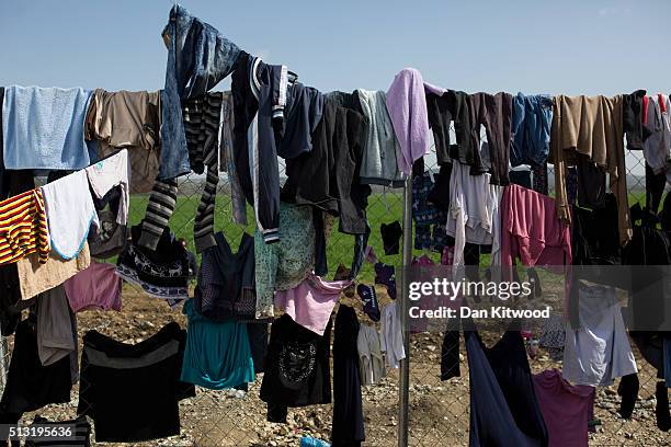 Clothes dry on a fence at the Greek-Macedonia border on March 01, 2016 near Idomeni, Greece. The transit camp has become overcrowded as refugees...