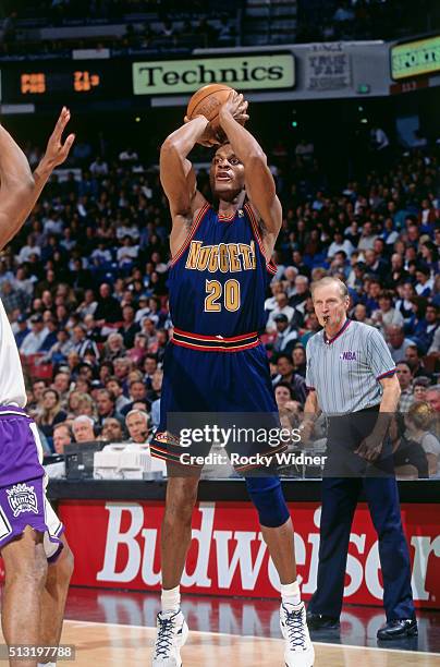 LaPhonso Ellis of the Denver Nuggets shoots against the Sacramento Kings circa 1997 at Arco Arena in Sacramento, California. NOTE TO USER: User...