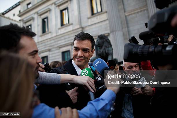 Spanish Socialist Party leader Pedro Sanchez speaks to the press as he walks in the street after his speech during a debate to form a new government...