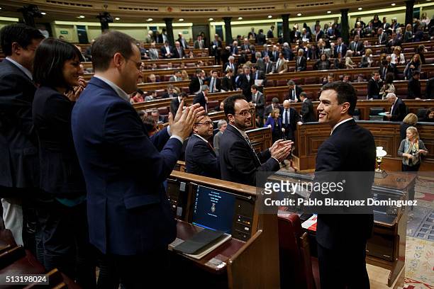 Spanish Socialist Party leader Pedro Sanchez looks on as party members applause him after his speech during a debate to form a new government at the...
