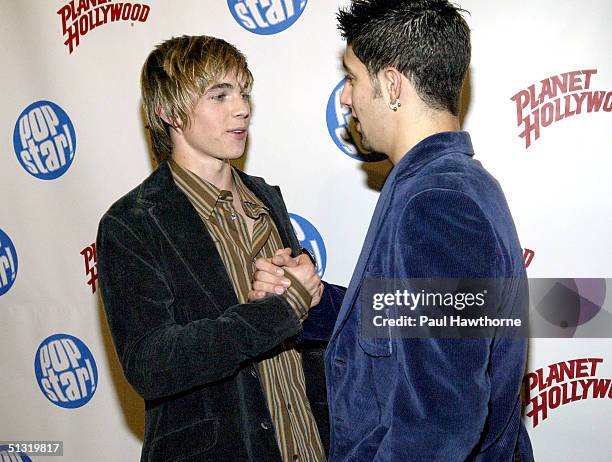 Singer Jesse McCartney and singer Greg Raposo pose at Popstar! Magazine's album release party for McCartney's new CD "Beautiful Soul" on September...