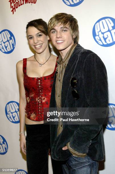 Actress Christy Carlson Romano poses for a photo with singer Jesse McCartney at Popstar! Magazine's album release party for McCartney's new CD...