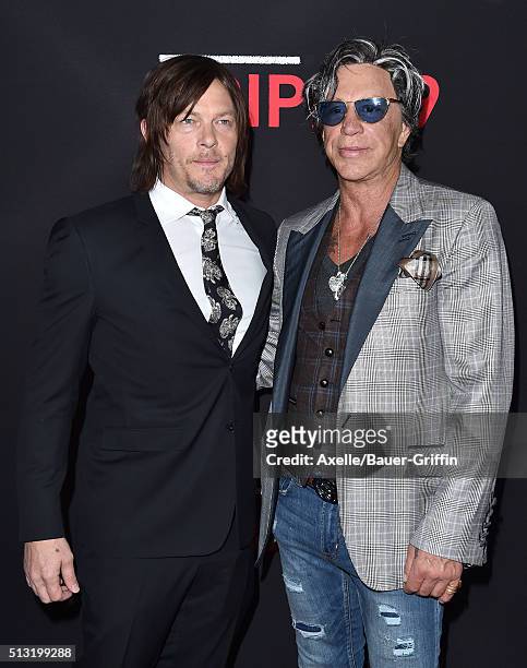 Actors Norman Reedus and Mickey Rourke arrive at the premiere of Open Road's 'Triple 9' at Regal Cinemas L.A. Live on February 16, 2016 in Los...