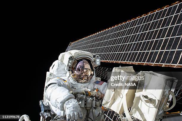 In this handout photo provided by NASA, NASA astronaut Scott Kelly works outside of the International Space Station during a spacewalk on November 6,...