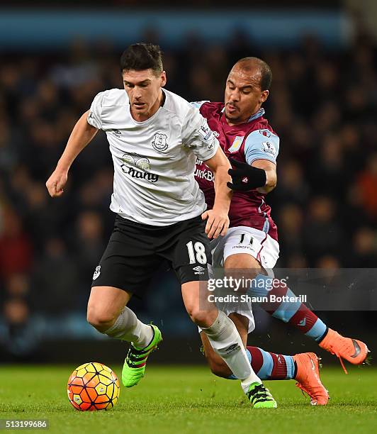 Gareth Barry of Everton and Gabriel Agbonlahor of Aston Villa compete for the ball during the Barclays Premier League match between Aston Villa and...