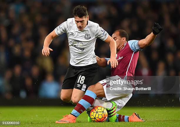 Gareth Barry of Everton is tackled by Gabriel Agbonlahor of Aston Villa during the Barclays Premier League match between Aston Villa and Everton at...