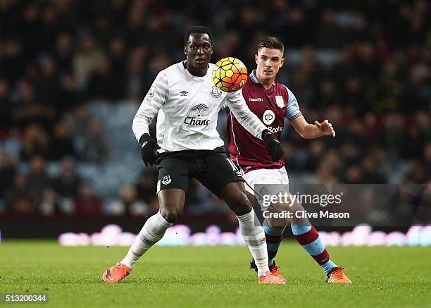 Romelu Lukaku of Everton controls the ball under pressure of Ciaran Clark of Aston Villa during the Barclays Premier League match between Aston Villa...