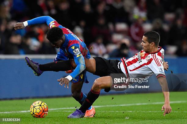 Wilfried Zaha of Crystal Palace is tackled by Jack Rodwell of Sunderland during the Barclays Premier League match between Sunderland and Crystal...