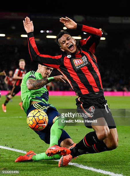 Joshua King of Bournemouth is tackled by Jose Fonte of Southampton during the Barclays Premier League match between A.F.C. Bournemouth and...