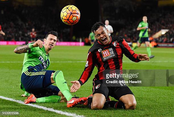 Joshua King of Bournemouth is tackled by Jose Fonte of Southampton during the Barclays Premier League match between A.F.C. Bournemouth and...