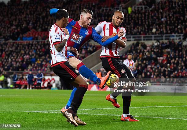 Connor Wickham of Crystal Palace competes for the ball against Patrick van Aanholt and Younes Kaboul of Sunderland during the Barclays Premier League...
