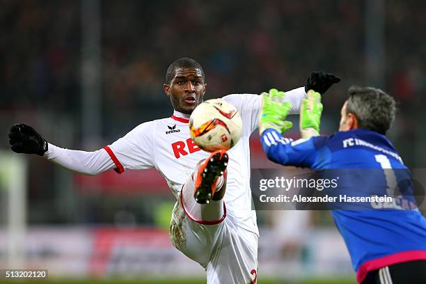 Anthony Modeste of Koeln battles for the ball with Ramazan Oezcan, keeper of Ingolstadt during the Bundesliga match between FC Ingolstadt and 1. FC...