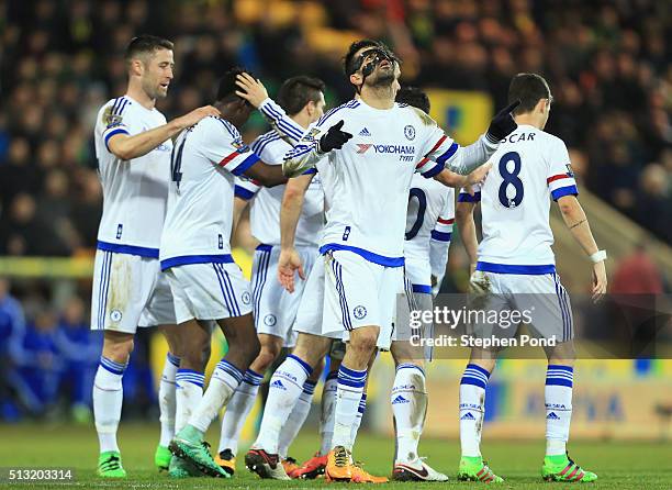 Diego Costa of Chelsea celebrates scoring his team's second goal with his team mates during the Barclays Premier League match between Norwich City...