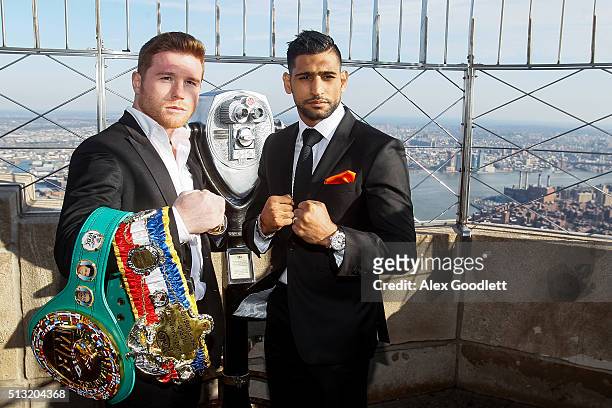 Canelo Alvarez and Amir Khan pose for photos during a press event at the Empire State Building on March 1, 2016 in New York City.