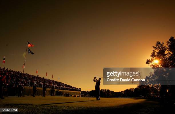 European Team player Darren Clarke of Ireland drives off the first tee during his four-ball match against Tiger Woods and Chris Riley of the USA in...
