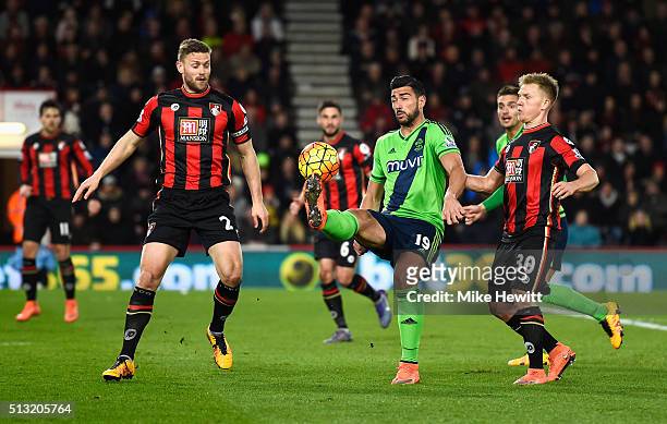 Graziano Pelle of Southampton controls the ball under pressure of Simon Francis and Matt Ritchie of Bournemouth during the Barclays Premier League...