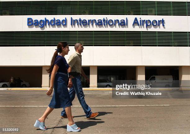 Iraqis walk near Baghdad International Airport September 18, 2004 Baghdad, Iraq. National carrier Iraqi Airways launched its first international...