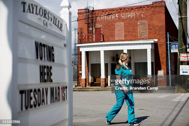 Georgia voter leaves Taylorsville Town Hall after voting on Super Tuesday March 1 in Taylorsville, Georgia. Voters head to the polls to cast their...