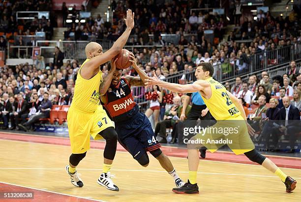 Bryce Taylor of Bayern Munich in an action against Alex King and Dragan Milosavljevic of Berlin during the ULEB Eurocup Basketball match between...