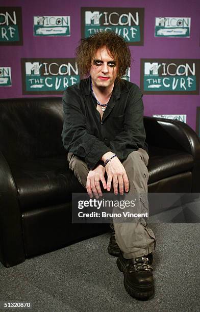 Singer Robert Smith from The Cure poses for photographs before "MTV Icon 2004 - The Cure" at Old Billingsgate Market on September 17, 2004 in London....