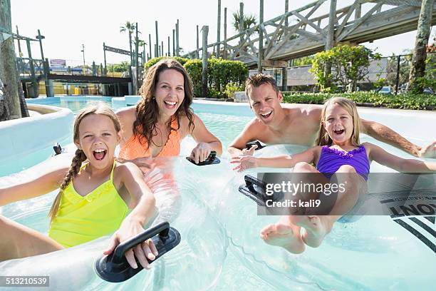 family on lazy river at water park - water park stock pictures, royalty-free photos & images