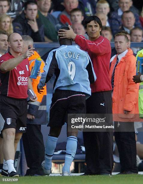 Chris Coleman manager of Fulham consoles Andy Cole, after he was sent off during the Barclays Premiership match between West Bromwich Albion and...