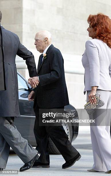 Accompanied by his wife Italian film star Sophia Loren , and holding his son Eduard Ponti's hand , Italian producer Carlo Ponti arrives at the...