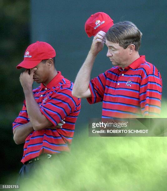 Ryder Cup teammates Tiger Woods and Davis Love III stand dejected on the 15th green during their Foursome match against European's Padraig Harrington...