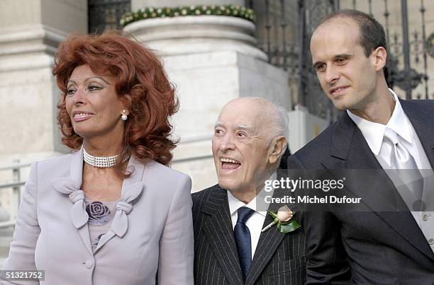 Carlo Ponti between son Edouard and wife Sophia Loren leaves St. Stephen's Basilica after his son's wedding to Andrea Meszaros September 18, 2004 in...