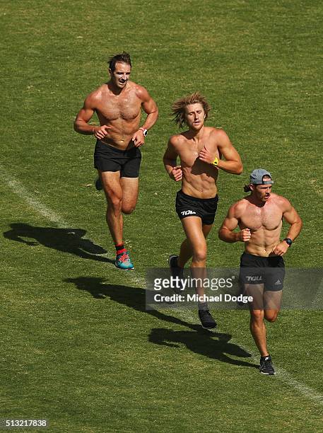 Travis Colyer leads Dyson Heppell and Jobe Watson in the last of their 1km time trials during a training session at St. Bernard's College on March 2,...